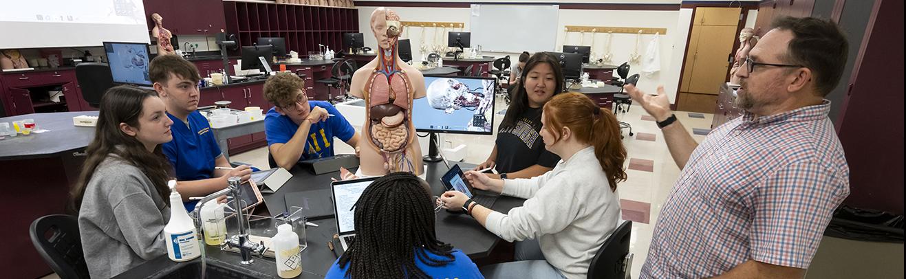 Nursing faculty Jake Dechant teaches an Anatomy class using an Anatomage Table.